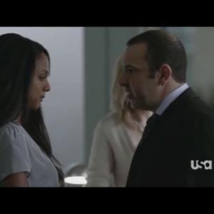 JaNae Armogan as Olivia with Rick Hoffman as Louis in SUITS