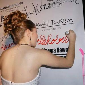 Annabelle Roberts signing her name at the 5th annual EurocinemaHawaii International Film Festival awards