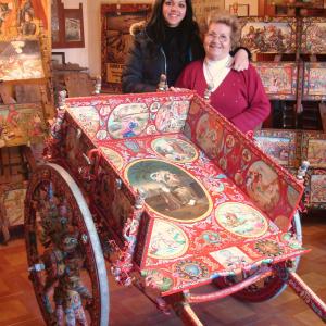 World-famous Sicilian cart artist, Nerina Chiarenza, featured in A SICILIAN ODYSSEY, with her granddaughter in Aci S. Antonio (Province of Catania)