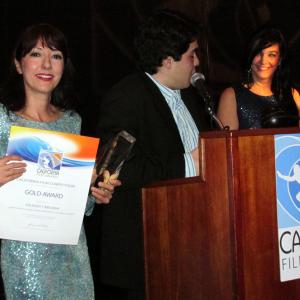Luciana Lagana, Everth Sotelo, And Ivone Reyes receiving the Gold Award for Best Short Film 