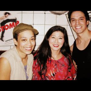 Lil Rhee with cast members of Stomp