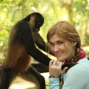 Natalia Reagan with a former pet spider monkey, Cantinflas outside of Pedasi, Panama.