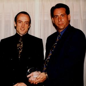 Receiving Manager Of The Year Award from United Artists Theatres President Neal Pinsker at ShoWest at Ballys Hotel in Las Vegas March 1999