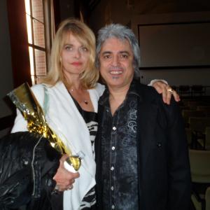 Nastassja Kinski and Boris Acosta at UCLA Dantes Inferno films screening party Nastassja Kinski holding golden bag with Infernal wine