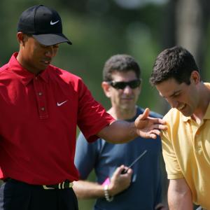 Dave gives Tiger Woods a golf lesson during the shoot for an EA Sports commercial