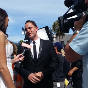Kyle Clements interviews with Extras Terri Seymour at the Los Angeles premiere of Terminator Genisys at The Dolby Theatre on June 28 2015 in Hollywood California