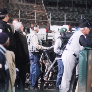 Candid shot of Alexander operating the Oakland As Sony Stadium HDTV Camera on the set of Moneyball Heeeyyeeeress the pitch