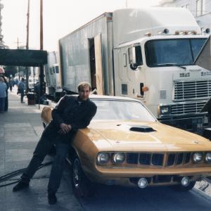 Alex as an SIU Agent in the Nash Bridges episode Wild Card is pictured here leaning on the Cuda with permission of course
