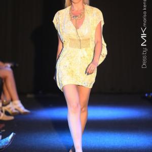 Recording Artist and Actress Aria Johnson walks the runway at the Sail In Style event, wearing Marisa Kenson in 2012.