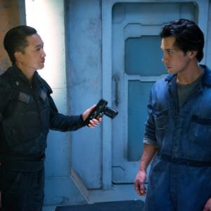 Still of Terry Chen and Bob Morley in The 100 2014