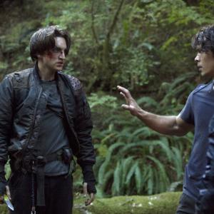 Still of Richard Harmon and Bob Morley in The 100 (2014)