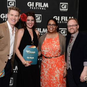 Woman Director Karen Weza winning the award for her film BEAUTIFUL SUNSET at GI Film Festival with Founders Major Laura Law and Brandon L Millett