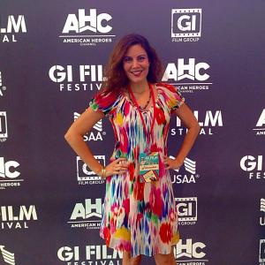 AwardWinning Director Karen Weza at GI Film Festival wearing a rainbow dress promoting Equality