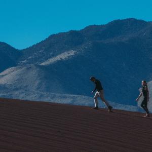 Producer Edward Winters Director Ashley Avis climb Cinder Mountain on the set of Deserted