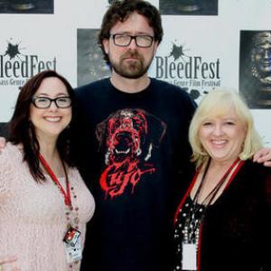 Elisabeth Fies and Brenda Fies present Inanna Award to Lucky Mckee at BleedFest Film Festival.