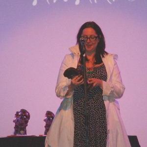 Writer/director of THE COMMUNE Lis Fies accepting a coveted skull Brammy for Best International Feature Film at the Bram Stoker International Film Festival