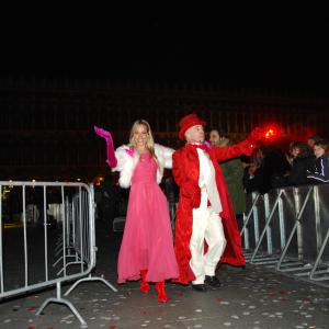 Jessica Polsky leaves the stage with cohost Doug Jack after hosting the internationally broadcast New Years Eve event in Venices Saint Marks Plaza to a live crowd of over 90000