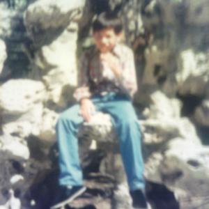 Edmund K Lo photo shoot in China on September 1986 Sitting on the Anther Rock near one of the Temple