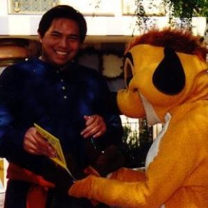 Edmund k Lo is getting his autograph from Lion King Timon at Disneyland on October 2011