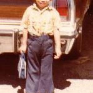 Edmund K Lo At Age 5 Years Old in front of his old house next to his dads car in Downey California USA