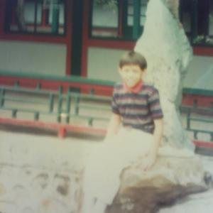 Edmund K Lo photo shoot in China on September 1986 Sitting on the stone next to the temple