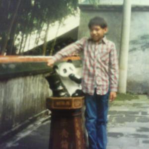 Edmund K Lo photo shoot in China on September 1986 Standing next to a statue of a Baby Panda