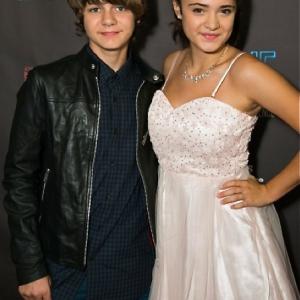 Actor Ty Simpkins and actress Luna Blaise arrive at Carrie The Killer Musical Experience Opening Night Red Carpet at Los Angeles Theatre on October 8 2015 in Los Angeles California