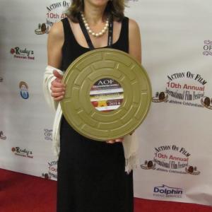Colleen with her award for Best Trailer for her Happy Acres Pitch Trailer at the 2014 Action on Film International Film Fest AOF