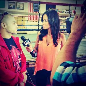 Crystal Marie Denha interviewing Vic Darchinyan for Top Rank Boxing at media day workouts.