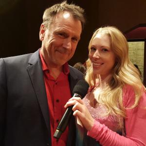 Jennifer Day asking all the right questions to Colin Quinn about his performance in TRAINWRECK