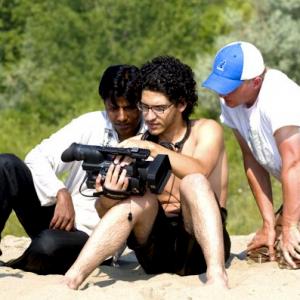 Director (Left),Camera Crew (Centre) and Art Director (Right) on set of film 