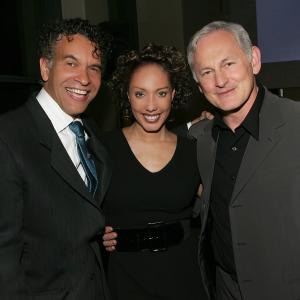 Joan Baker embraces L Brian Stokes Mitchell  R Victor Garber at the launch event The Champions Consumer Campaign for the Alzheimers Association at the Top of The Rock
