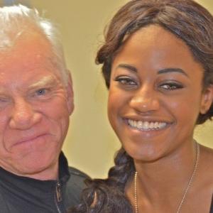 Malcolm McDowell and Desiree McKinney exchanging giggles on the set of Zombex