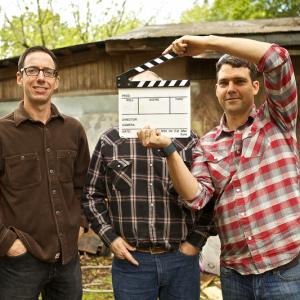 Moonshine  Mojo Hands web series coproducers Roger Stolle L and Jeff Konkel R with anonymous Mississippi moonshiner during filming