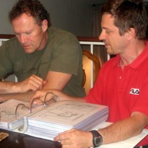 Max and Michael Rooker looking at the storyboards of their next film 