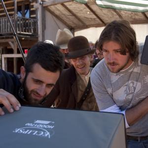 Director Tanner Beard watches playback with Director of Photography Nathanael Vorce and Actor Lou Taylor Pucci