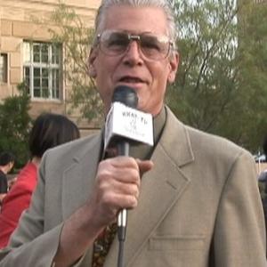 Ed Sharpe as the newsman