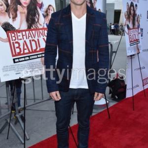 Lachlan Buchanan arrives at the premiere of Behaving Badly in Los Angeles