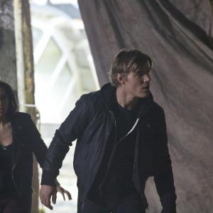 Still of Jessica Parker Kennedy and Chris Zylka in The Secret Circle 2011
