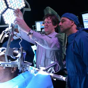 Teaching Stanley Tucci the technique of Deep Brain Stimulation.