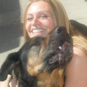 Lisa and her dog Enzo. She rescued him from 2500 miles away sight unseen, not even a picture as he was only given a day to be rescued and he captured her heart, Enzo a wonderful soul.