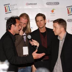 Atlanta Film Festival host Philip Covin interviewing actors Walt Goggins and Ray McKinnon, along with Scott Teems, director of 