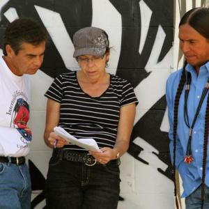Urban Rez executive producer writer editor Lisa D Olken reviewing script with director Larry Pourier and host Moses Brings Plenty