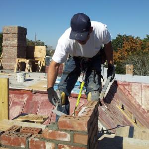 Topping off a 50 foot chimney.