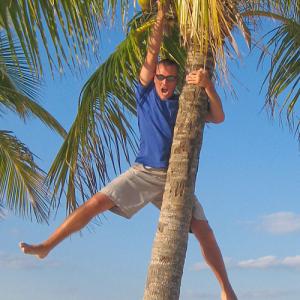 Mike Theiss climbing and hanging from Palm Trees in Florida
