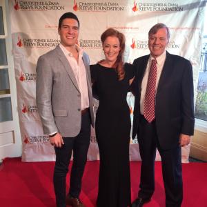 Adele Rene serving as MC of the CDRF Gala on Dec 7, 2014. Here with Christopher Reeve son, Will Reeve, and President and CEO of Christopher and Dana Reeve Foundation, Peter Wilderotter