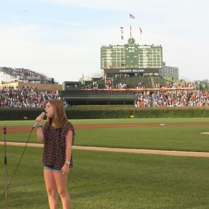 Jami sings the National Anthem at Wrigley Field.