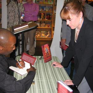Carlton signing his awardwinning book Front  Center  How I learned To live There for Christine Elise