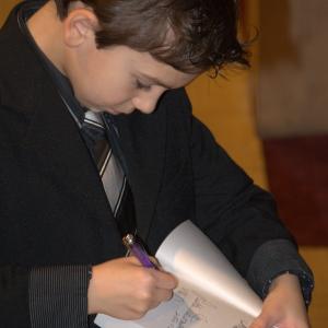 Michael signs copies of Mrs Miracle at movie premiere