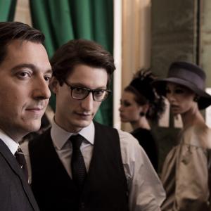 Still of Guillaume Gallienne and Pierre Niney in Yves Saint Laurent 2014